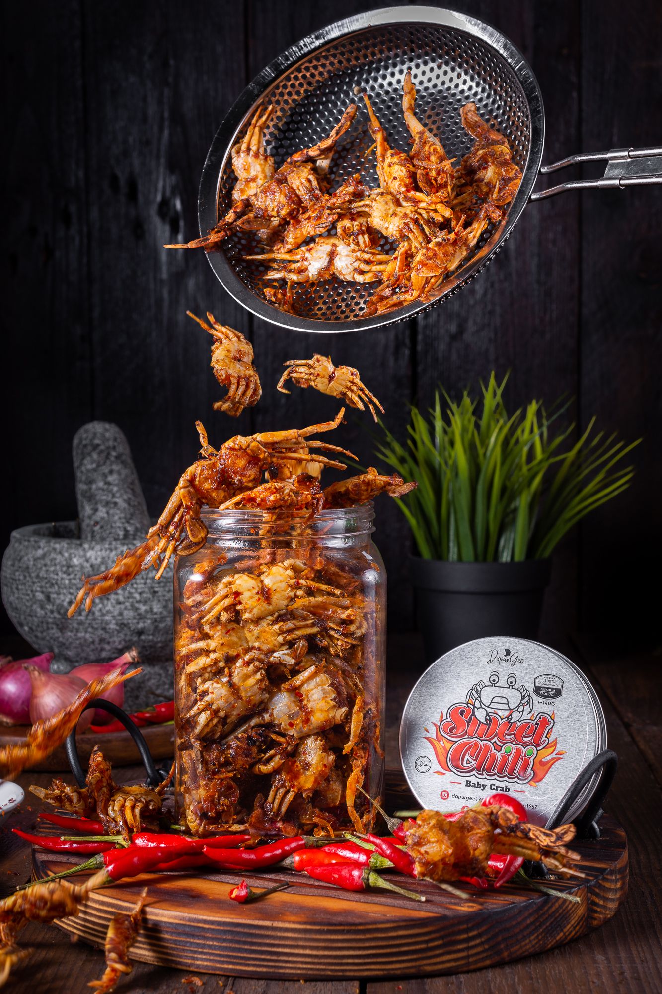 Dramatic dark food photography of grilled seafood with flames and garnishes.