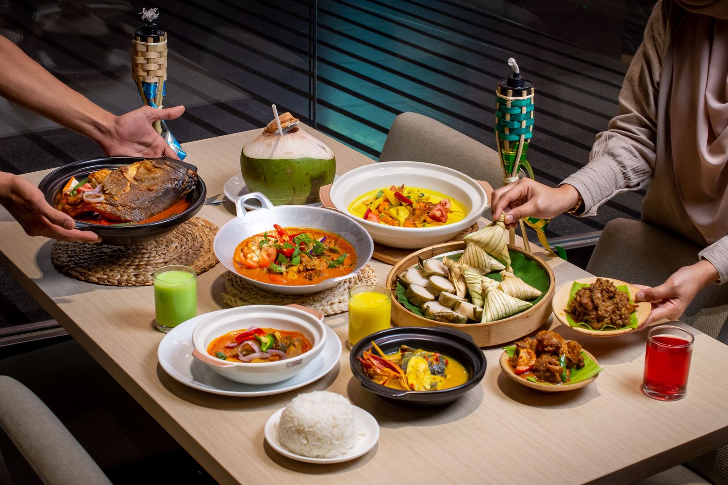 Aerial view of multiple dishes and drinks being served on a restaurant table.