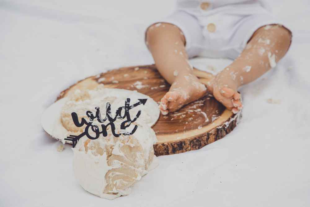 Hands covered in flour and dough while baking in a rustic kitchen setting.