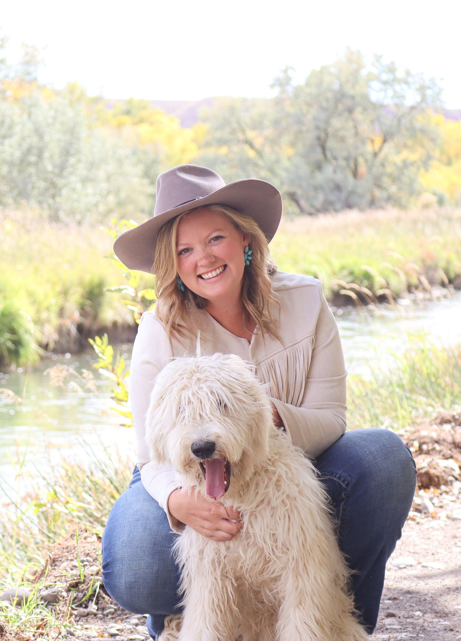 Headshot of a photographer specializing in adventure elopements, with a backdrop of nature