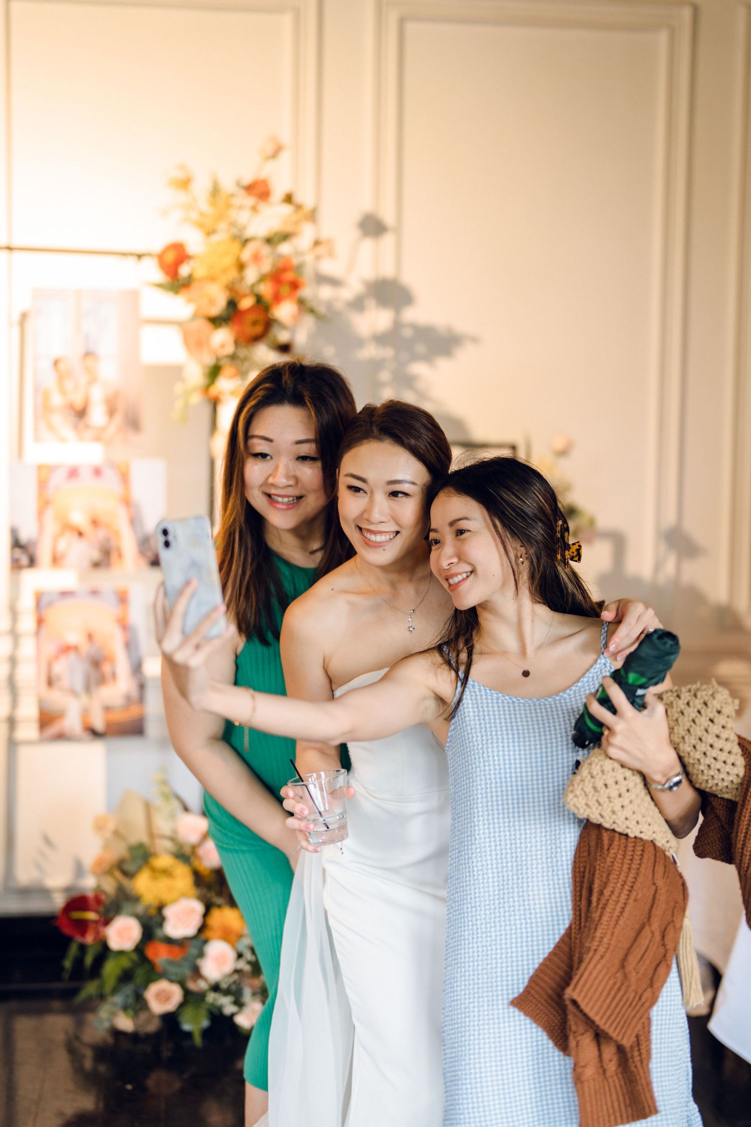 Wedding celebration with guests sharing joyful moments in a bright venue.
