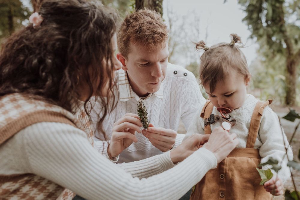 Intimate family moment captured while exploring nature together outdoors.