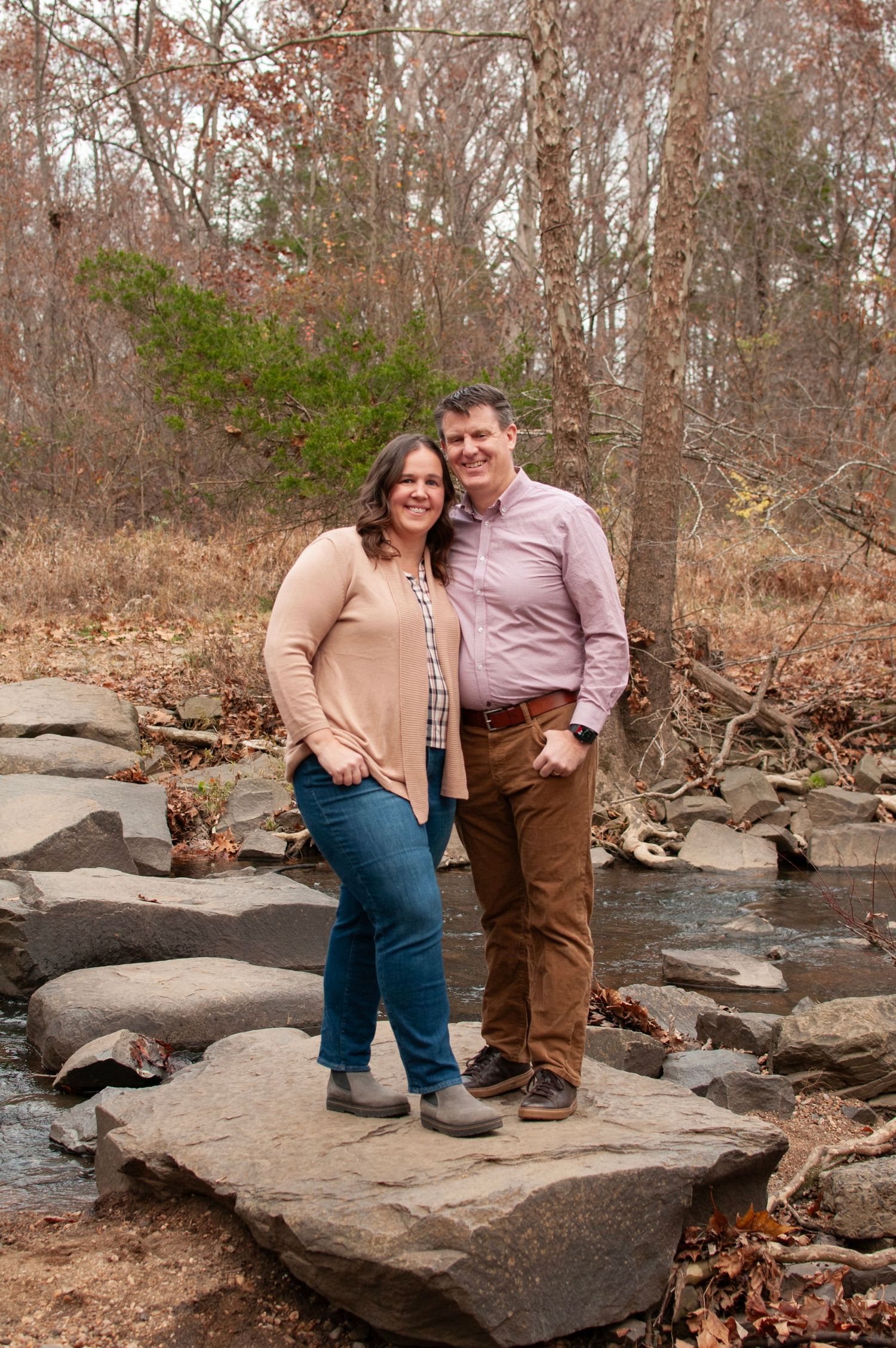 Parents standing together outdoor pose
