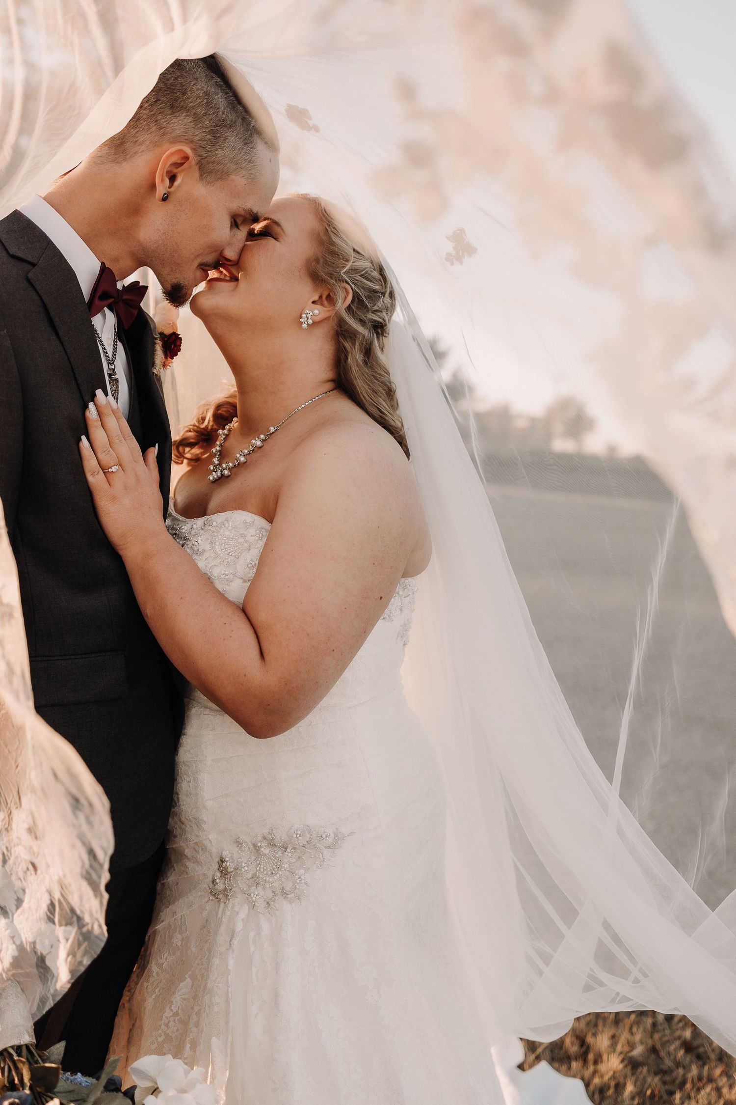 Bride with stunning soft glam makeup by Gaby Makeup Artistry, on a sunny day in Oklahoma City.