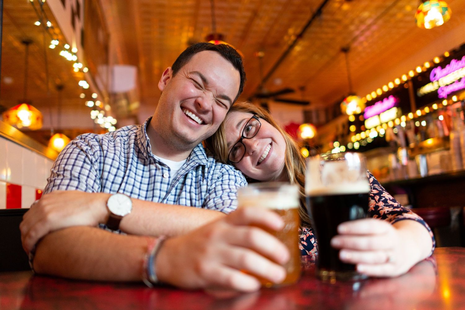 Candid engagement portraits with beer at Charlie's Kitchen in Harvard Square with Leah Ramuglia photography