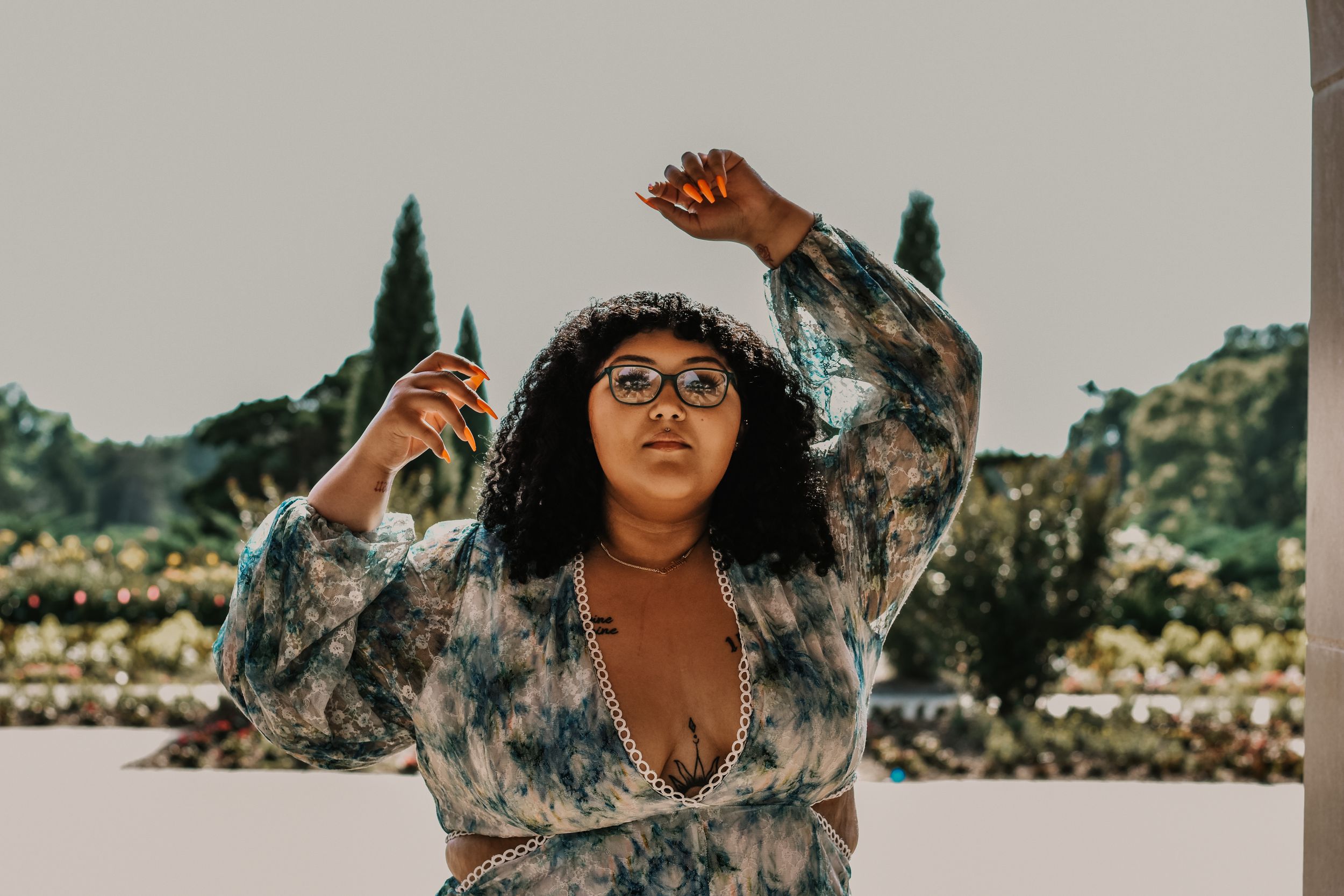 An artistic young woman poses for the camera