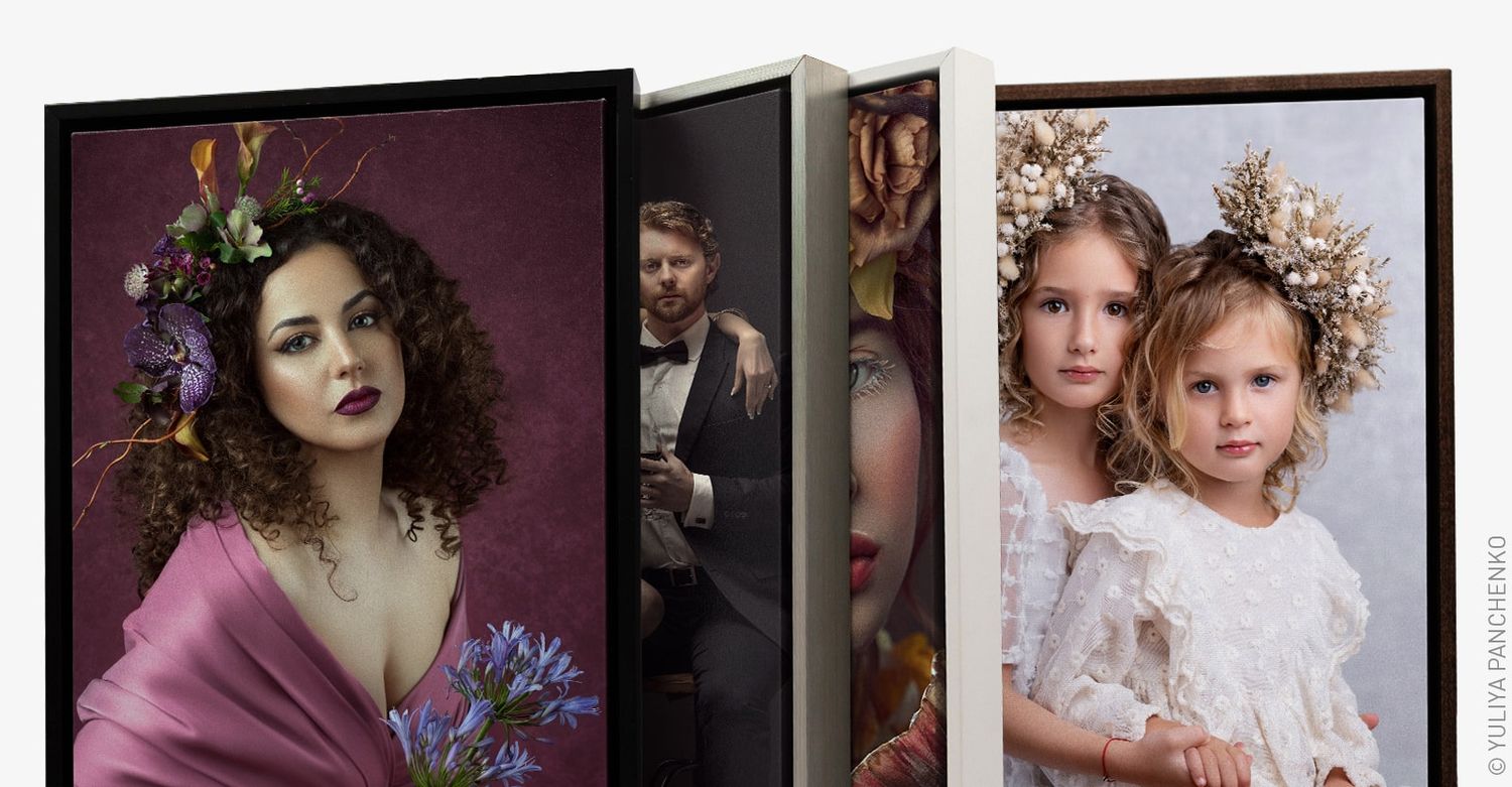 Art gallery wall displaying framed portrait photographs with floral elements.
