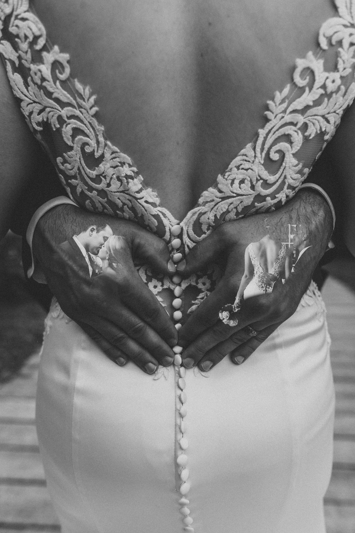 Detail shot of lace wedding dress back with buttons and intricate embroidery pattern.