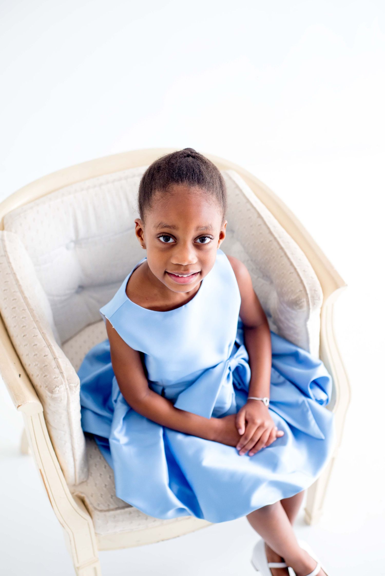african american girl in a blue dress taking portraits in houston texas