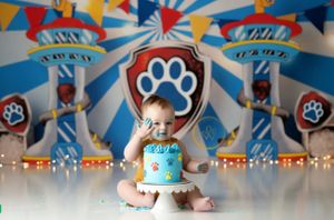 Paw patrol themed party setup with blue and red decorations and festive banners.