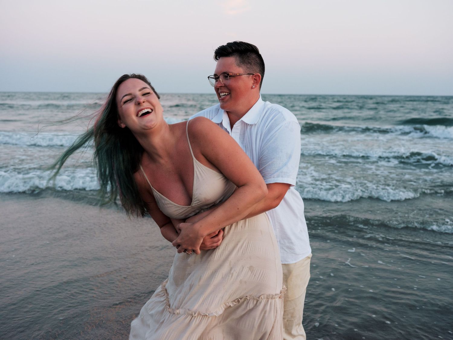 couples propose on the beach