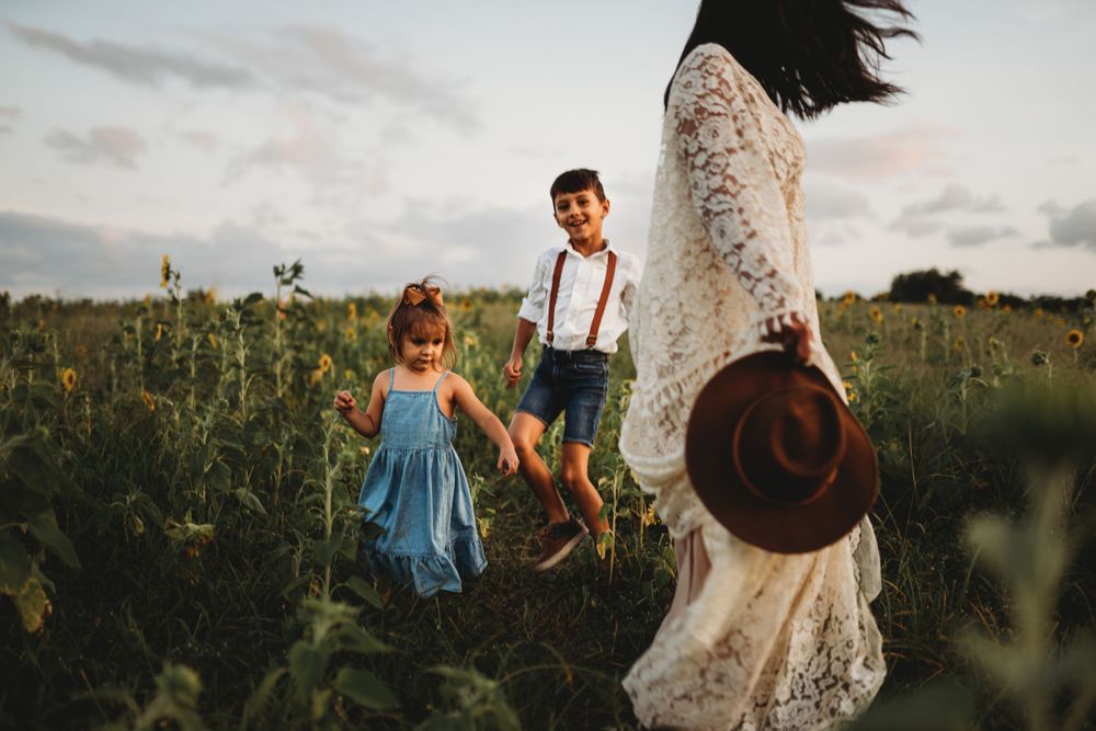 A dreamy family photo session in a wildflower field at sunset.