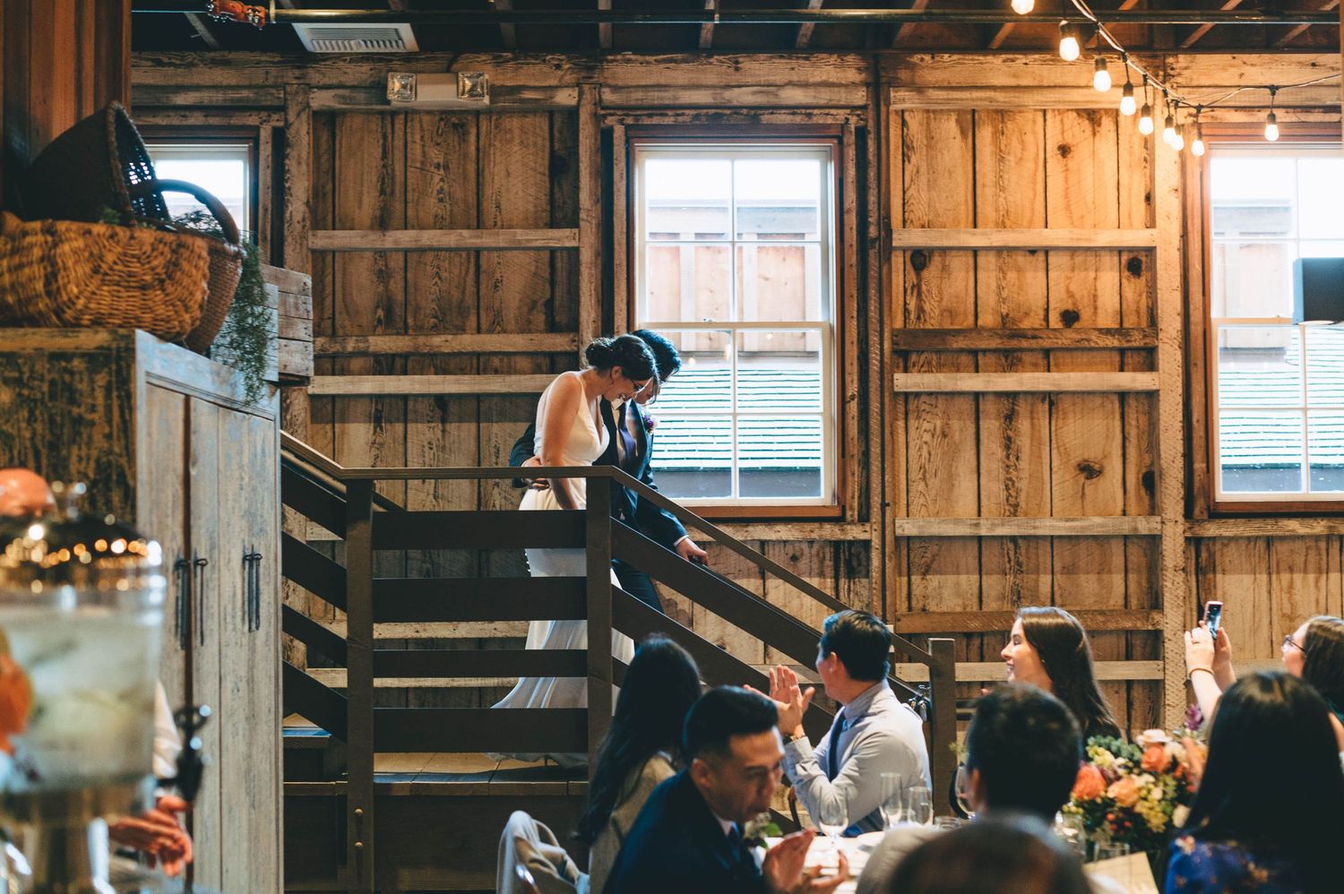 bride and groom making their grand entrance in the barn at cooper molera in Monterey