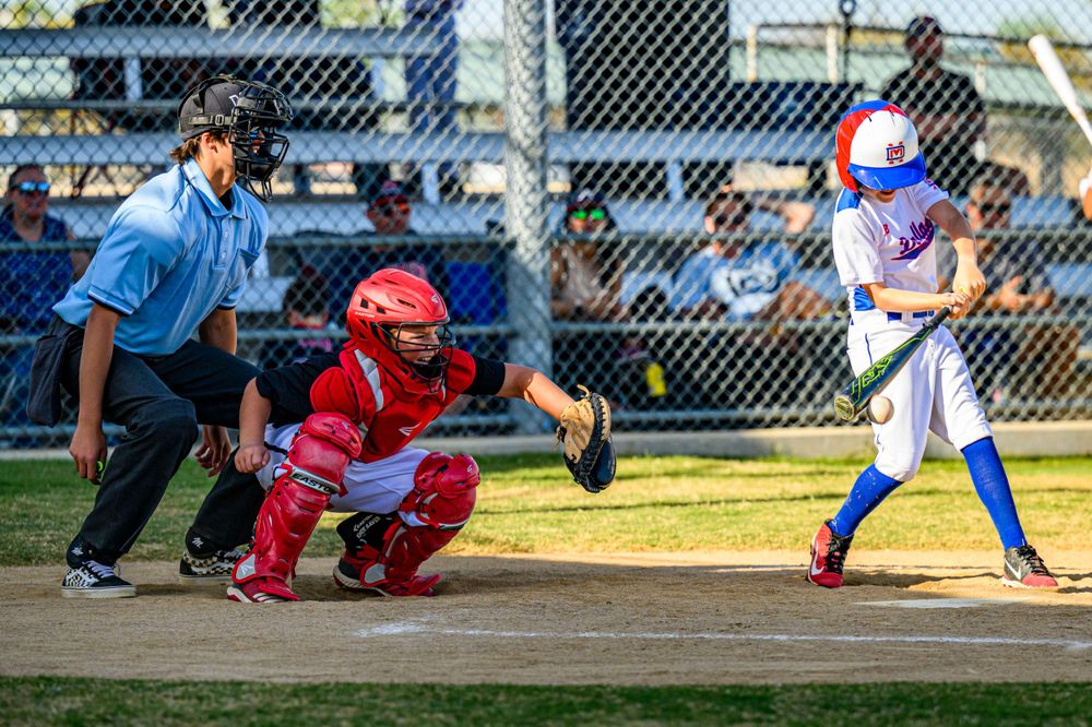 youth boys baseball player game action photo home plate umpire catcher batterfrisco texas