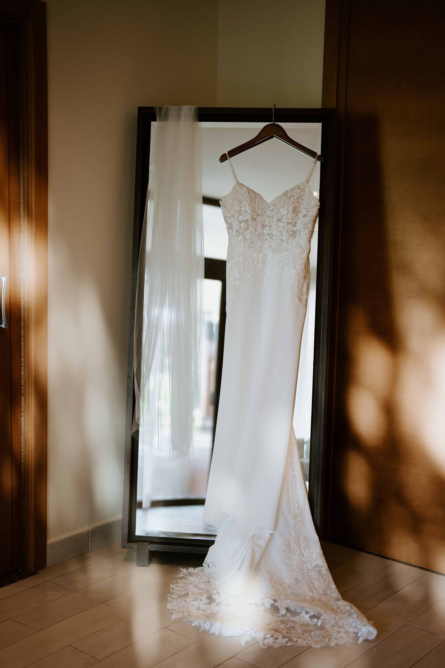 The bride's dress, a masterpiece of elegance, flowing with grace and timeless beauty