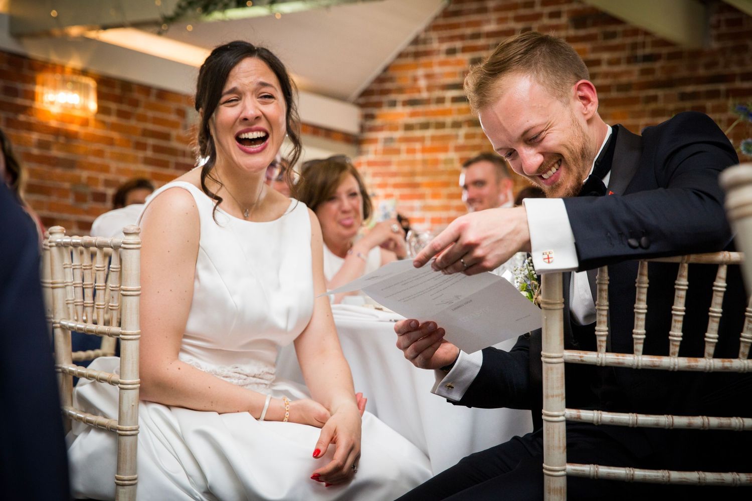 Joyful moments shared between wedding guests during reception celebrations.