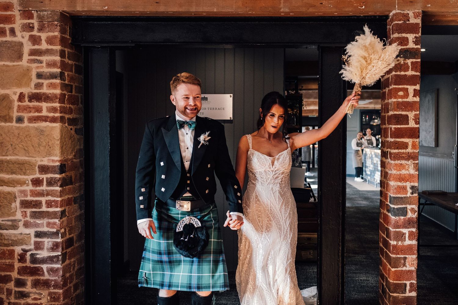 bride and groom cheering