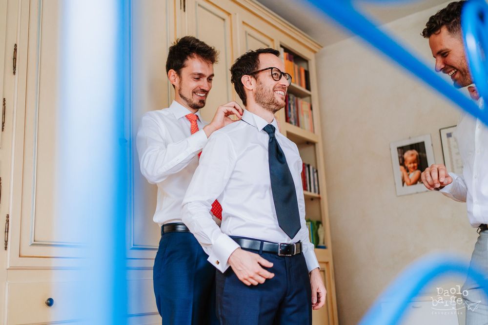 Wedding preparation scene with formal attire and festive decorations.