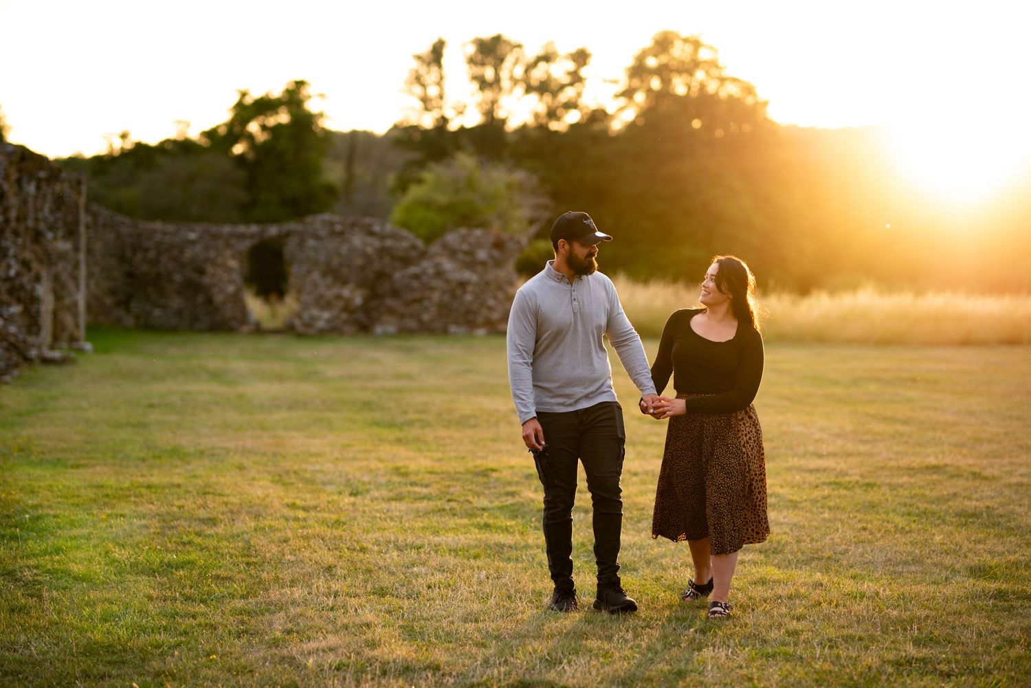 Couple walking in the sunset. Waverley Abbey ruins in the background. Couple Photography, Engagement Photography