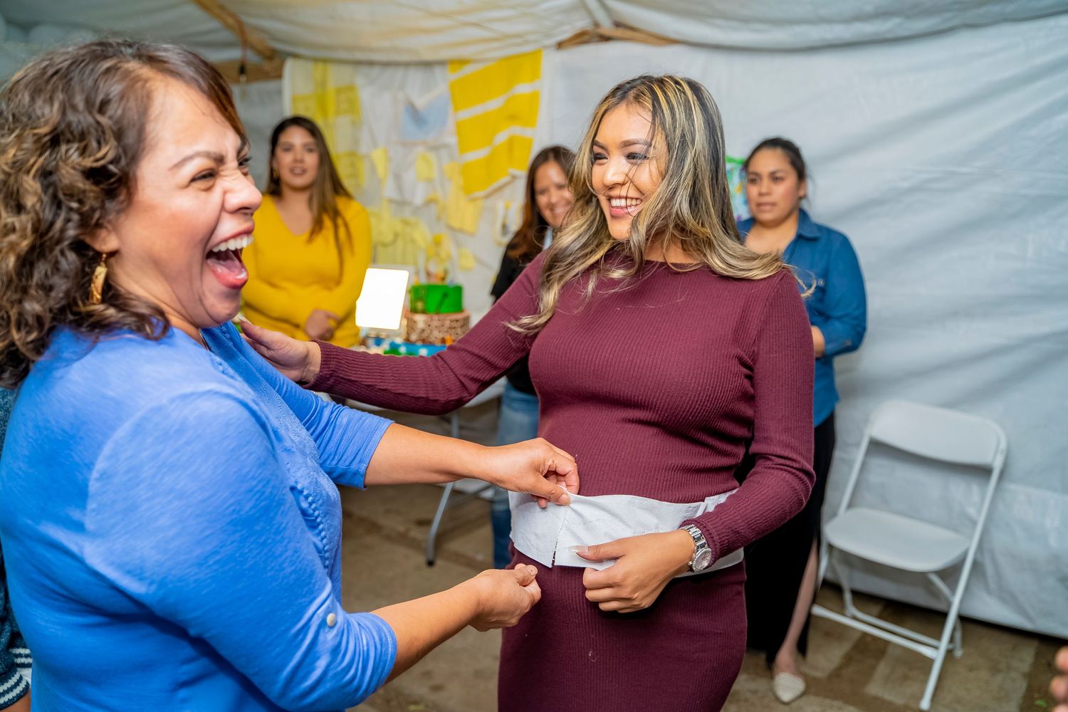 Joyful moment shared during a baby shower celebration.