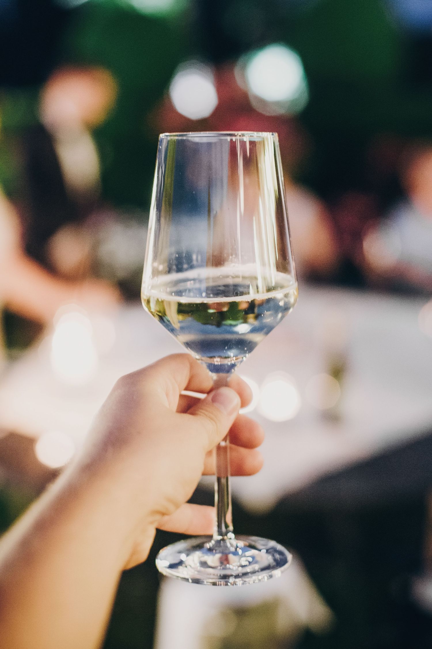 Hand holding glass of champaigne