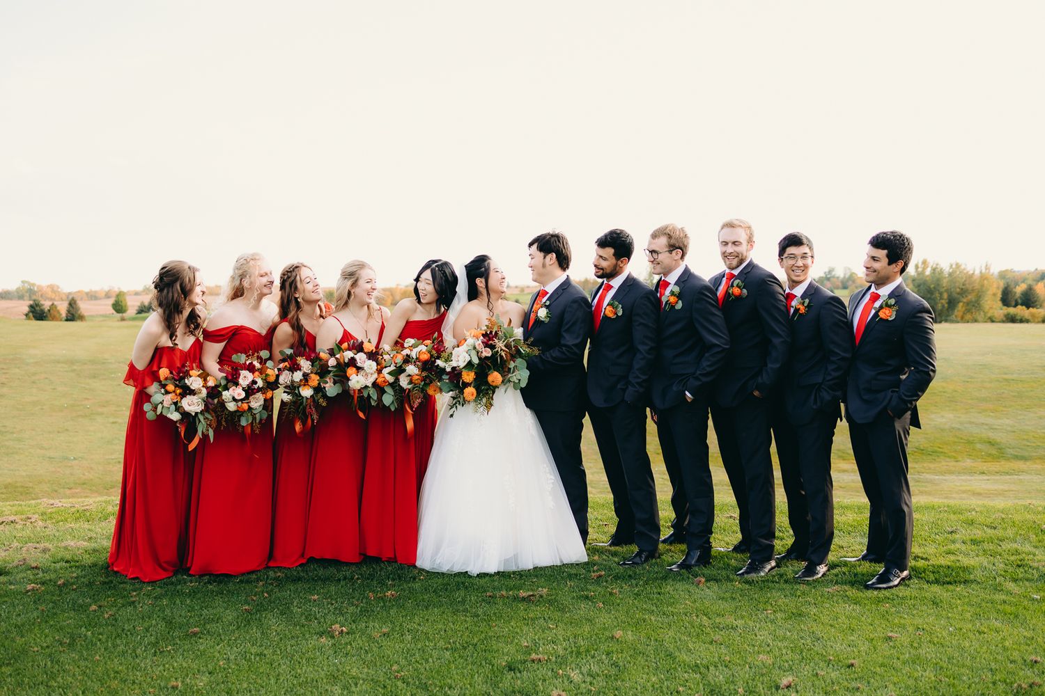 bride and groom with wedding party