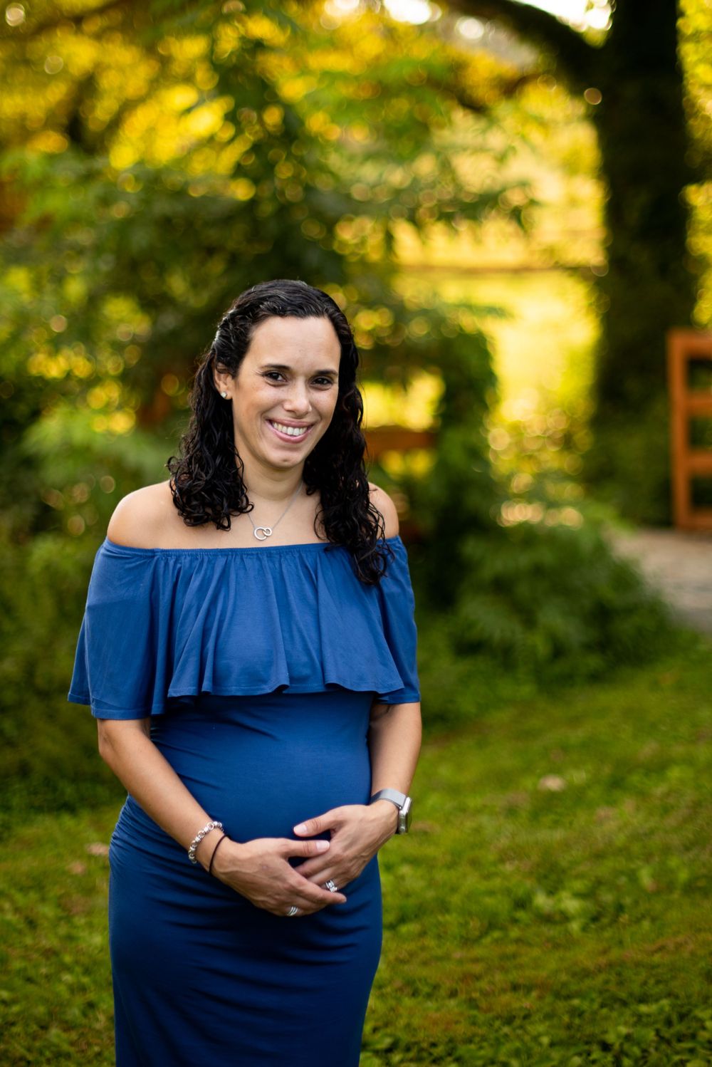 A pregnant women holding her belly
