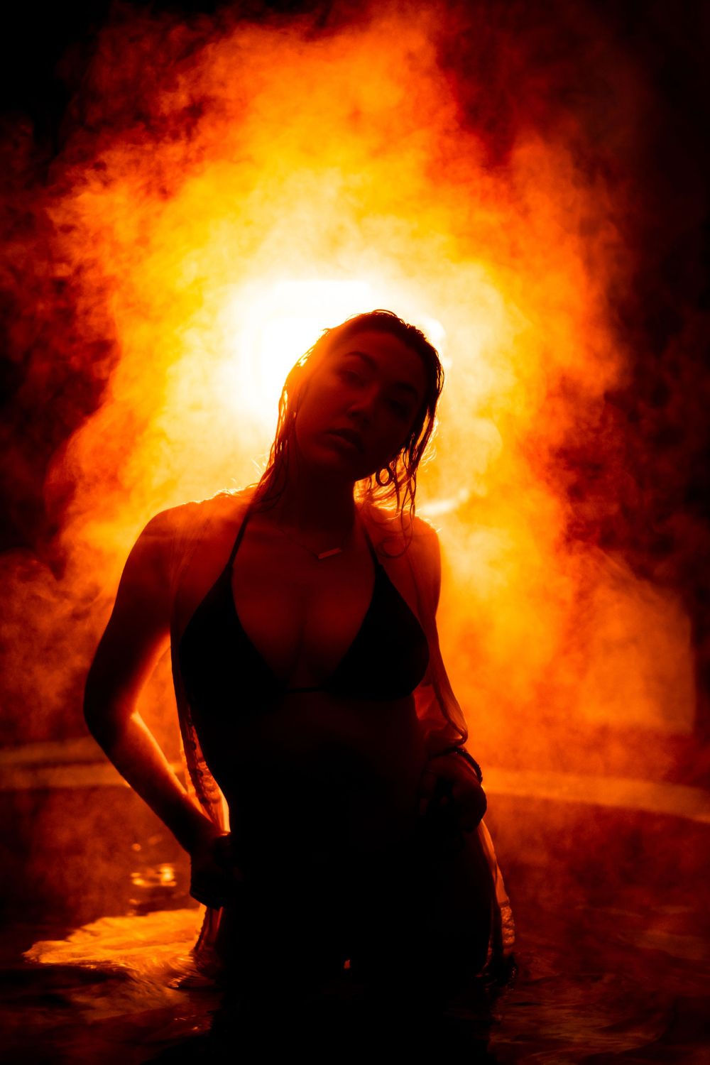 Dramatic silhouette photo series against a fiery orange background with smoke effects.
