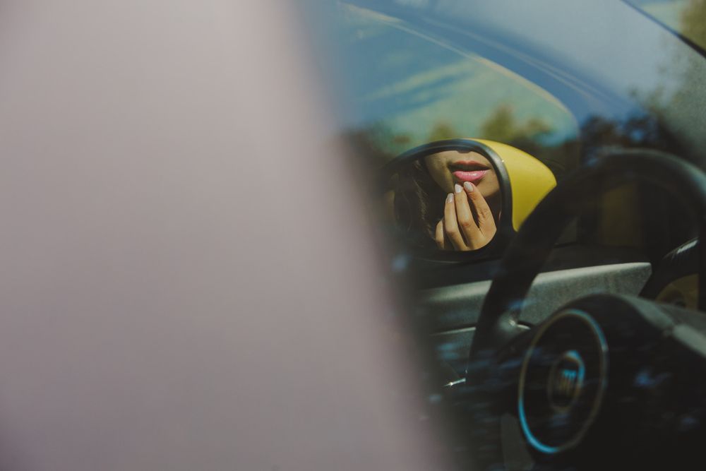Artistic close-up shot through car window with yellow details.