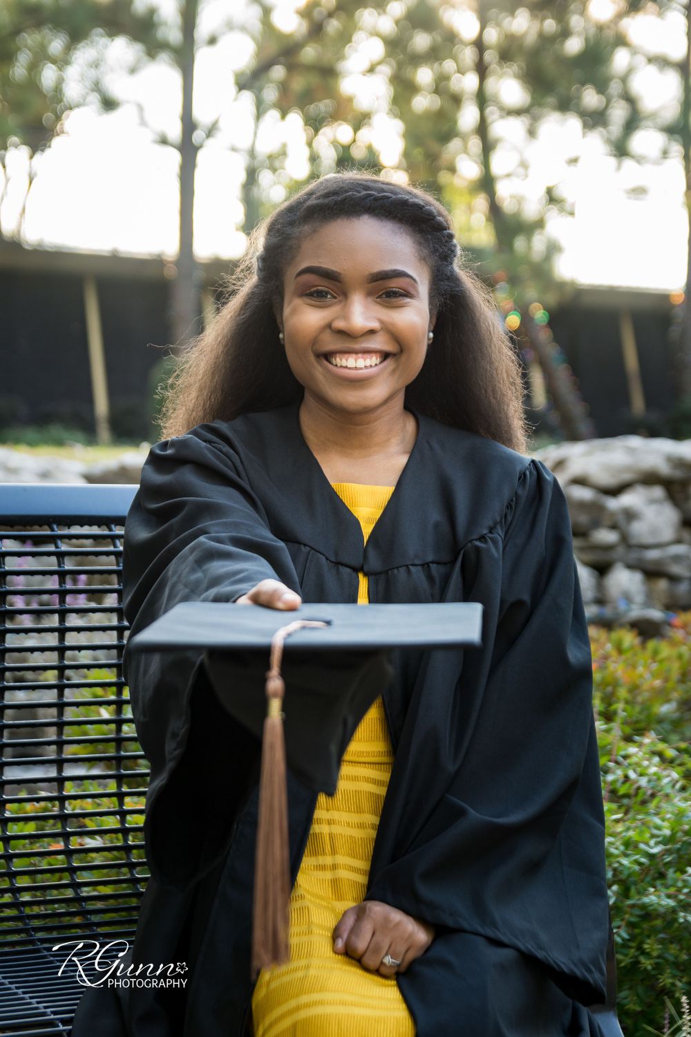 Graduating senior with cap and tassel in Prayer Gardens