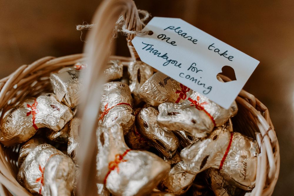 a wicker basket of gold lindor lindt bunny chocolates
