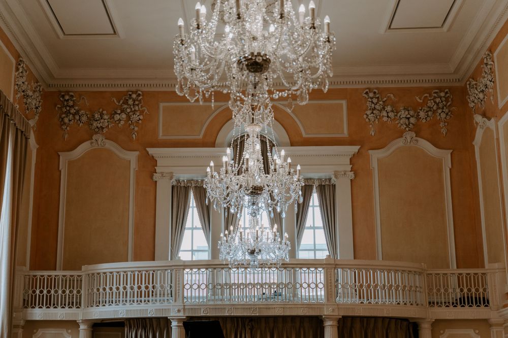 a chandelier in a wedding ceremony room.