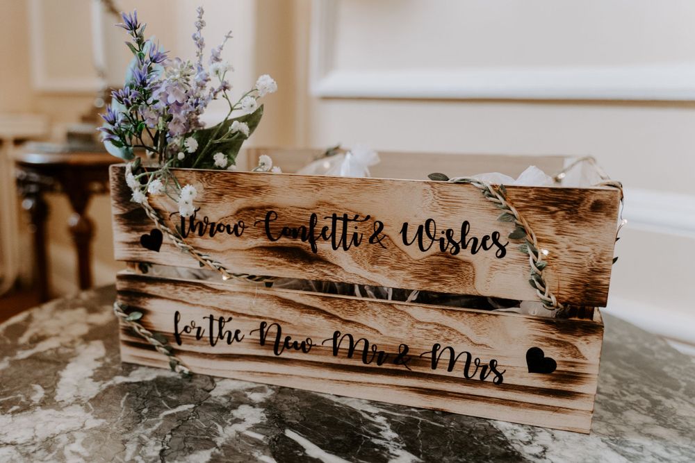 a wooden box of confetti