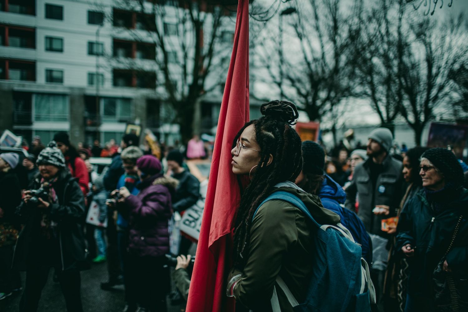 Black protester listens to speaker at Black Lives Matter Reclaim MLK march portland oregon photojournalism