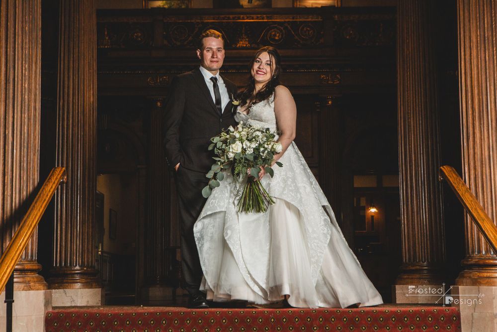 Wedding Couple. Bride and Groom at top of stair entrance.