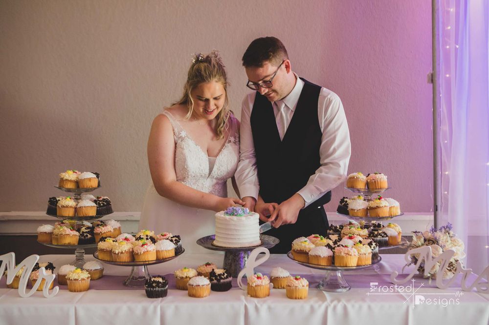 Bride and Groom cutting their wedding cake.