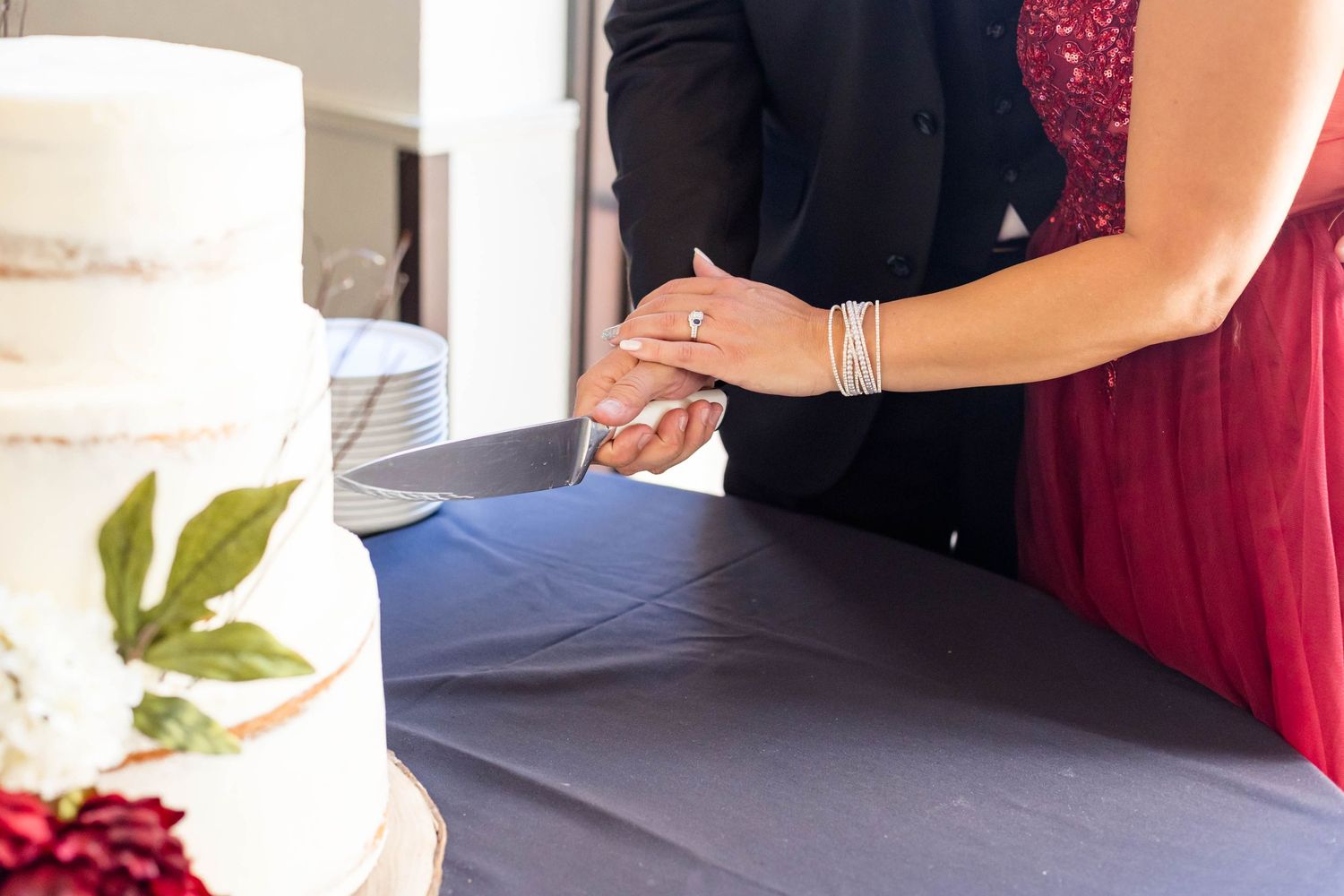 bride and groom cut the cake