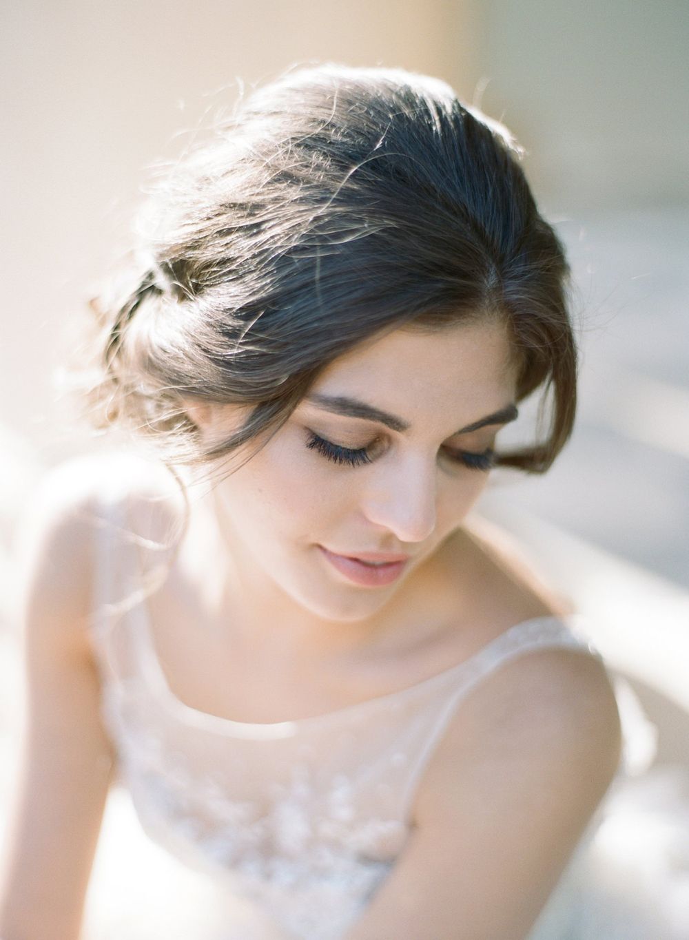 Soft ethereal bridal portrait with delicate lace details and romantic styling.