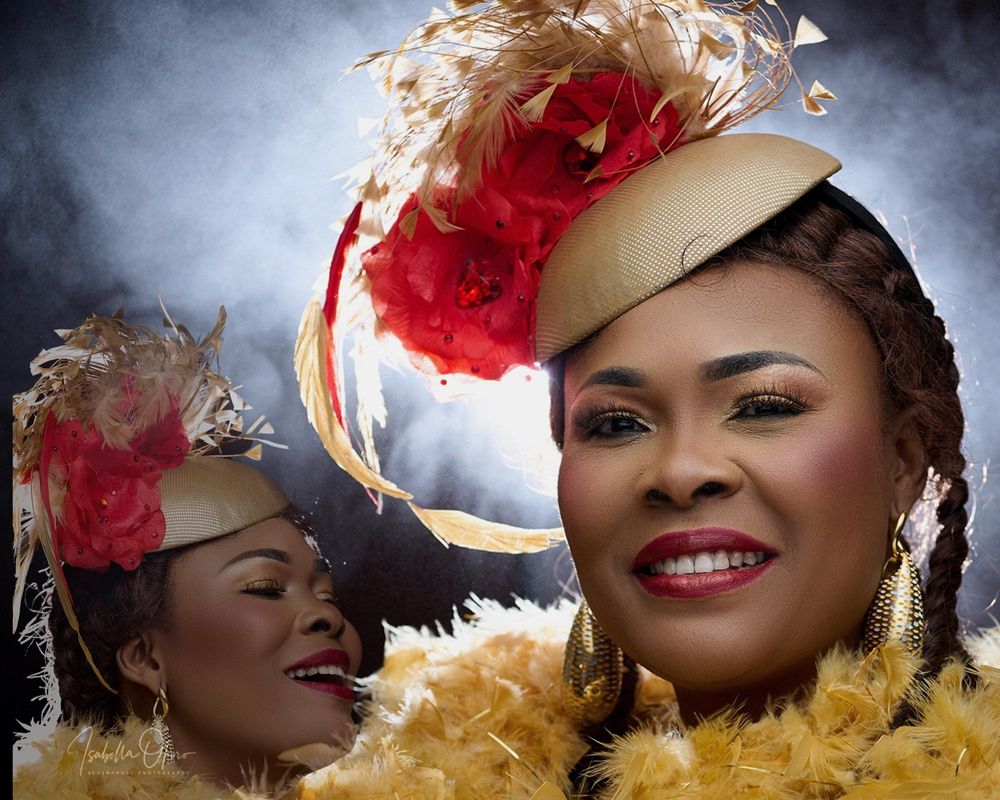 Artistic dual portrait with red floral hat and yellow feather accents against dramatic lighting.