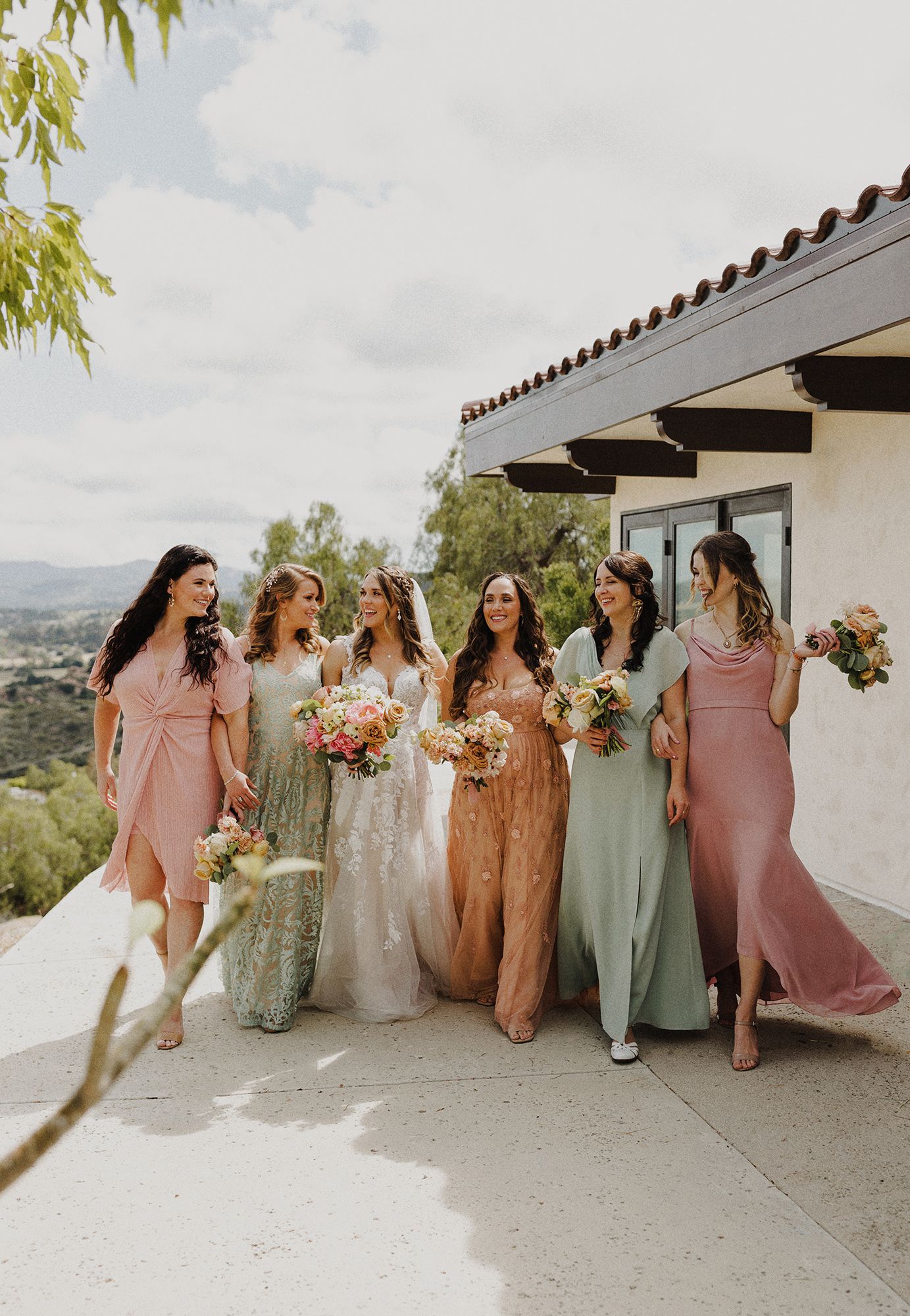 E Noelle Photography in-home wedding in Hidden Hills Los Angeles, bridal orange, bridesmaids walking towards camera