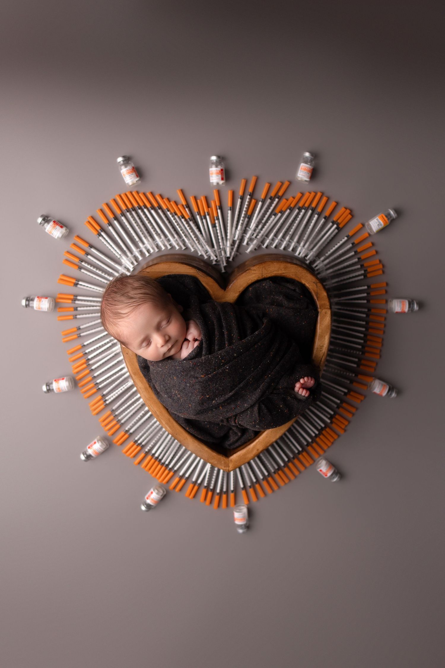 Newborn boy photo, with IVF needles, taken by Jen Knightstep, Photographer