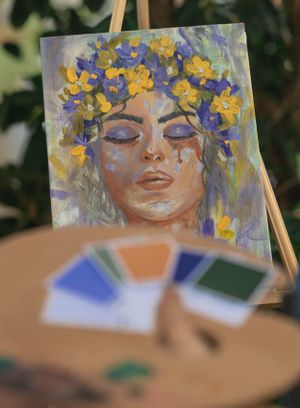 A vibrant painting featuring yellow and purple flowers in a crown-like arrangement.