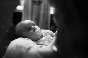 Black and white close-up portrait in soft lighting.