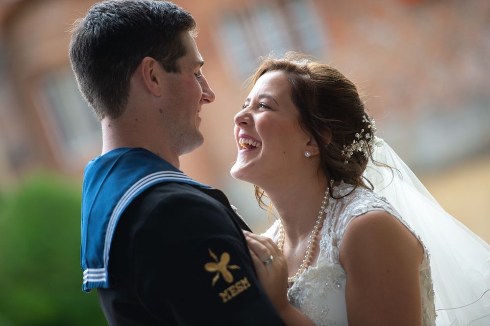 Intimate wedding portrait moments captured against stone architecture.
