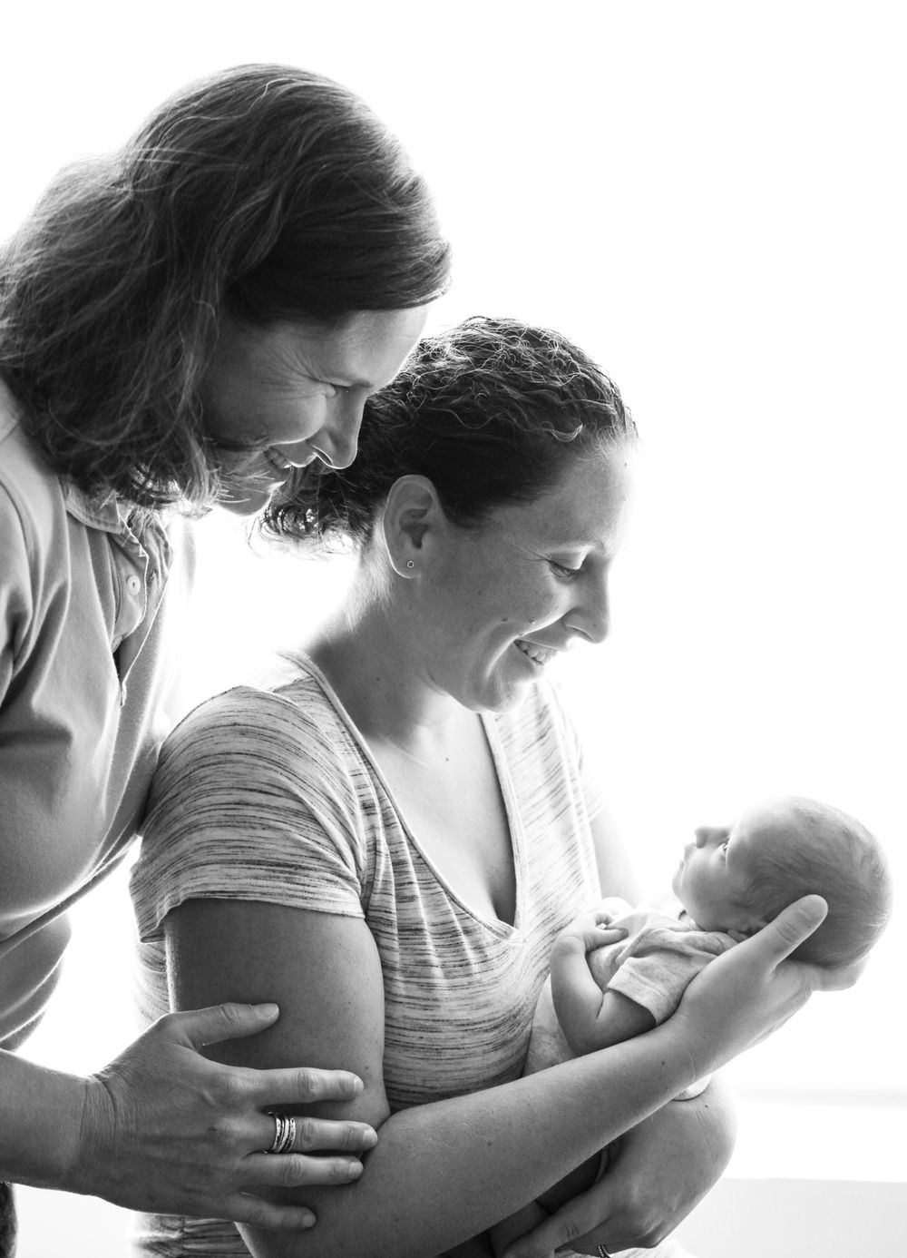 Black and white series showing tender nurturing moments in side profile.