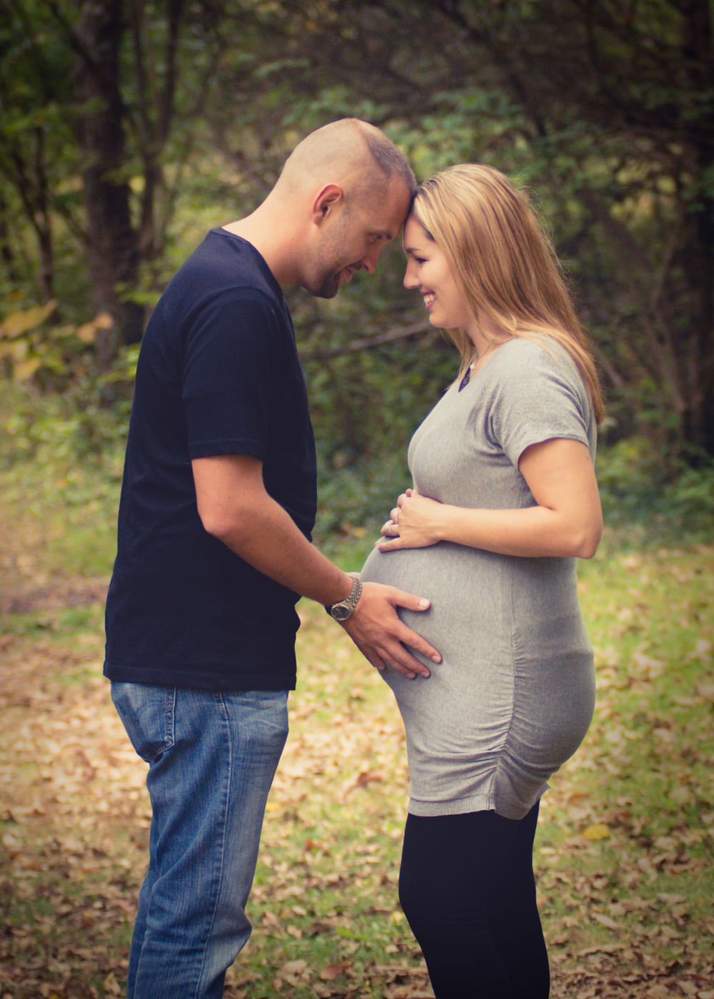 Outdoor photo of pregnant woman and her husband taken during a maternity session by professional maternity photographer in East Tennessee