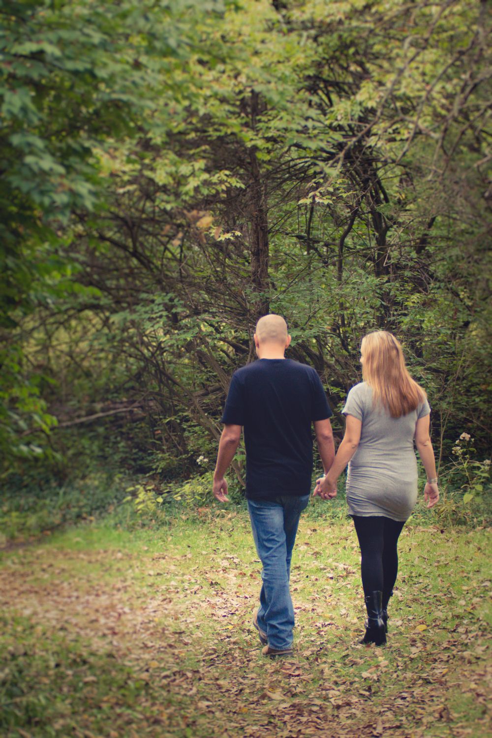 Outdoor photo of pregnant woman and her husband taken during a maternity session by professional maternity photographer in East Tennessee
