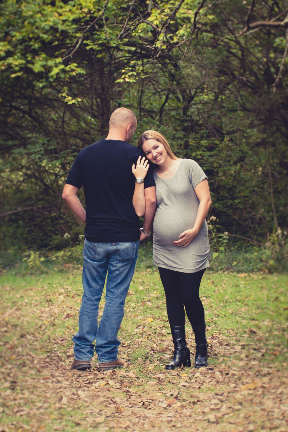 Outdoor photo of pregnant woman and her husband taken during a maternity session by professional maternity photographer in East Tennessee