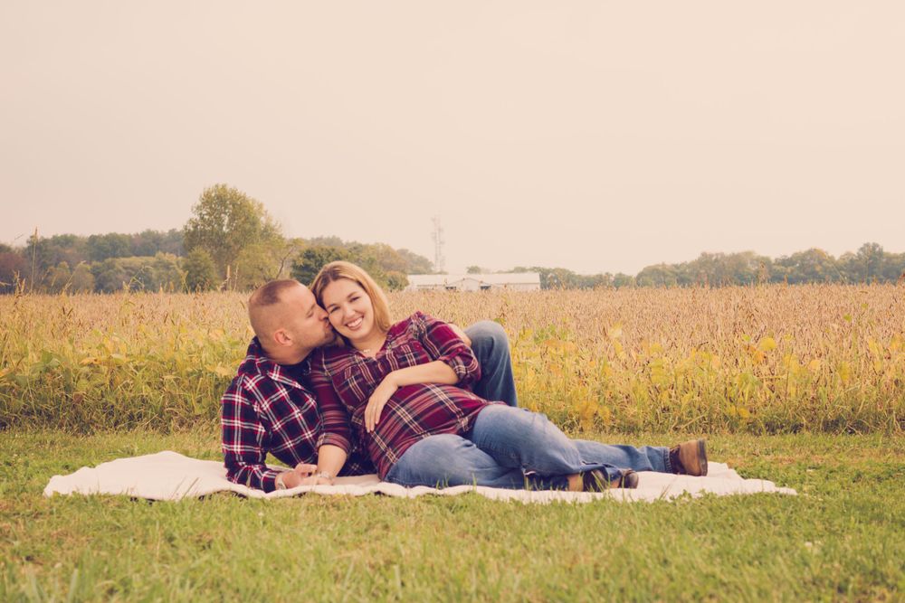 Outdoor photo of pregnant woman and her husband taken during a maternity session by professional maternity photographer in East Tennessee