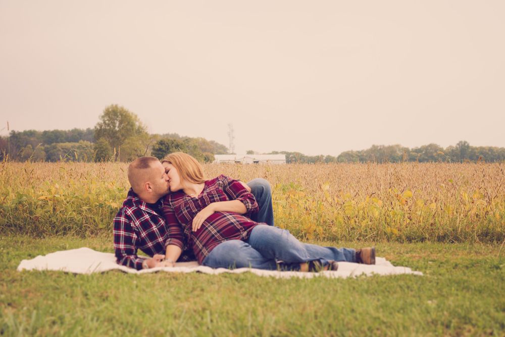 Outdoor photo of pregnant woman and her husband taken during a maternity session by professional maternity photographer in East Tennessee